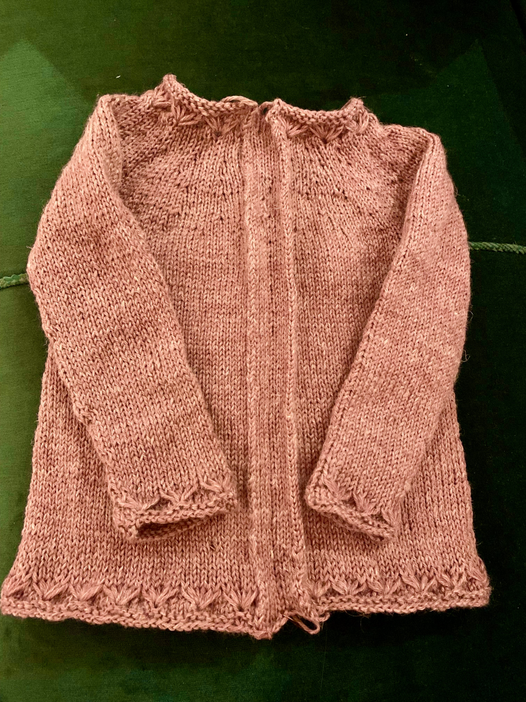 Knitted cardigan ready to be steeked